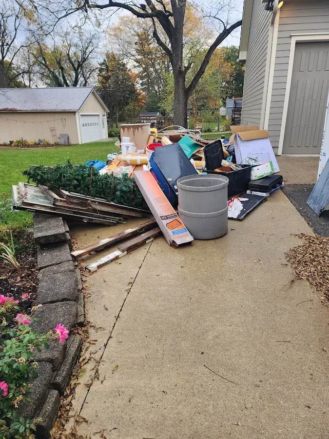 Dumpster being loaded with debris for Residential Dumpster Rental in Colts Neck